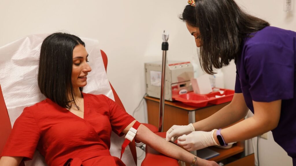 Healthcare provider drawing blood from a pregnant woman's arm for a lead blood test, how to prevent lead exposure during pregnancy
