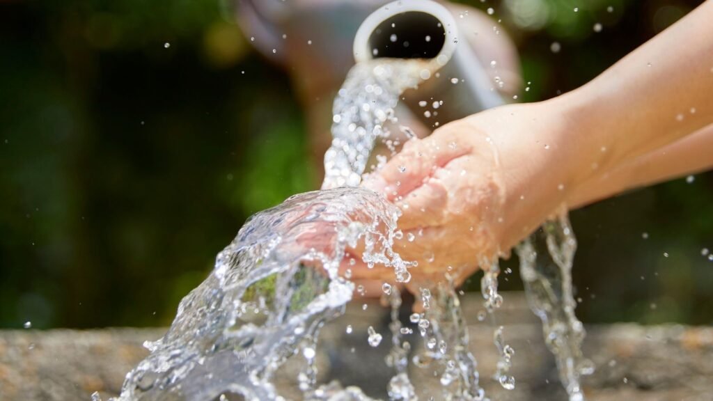 Pregnant woman testing her tap water for lead using a home water test kit